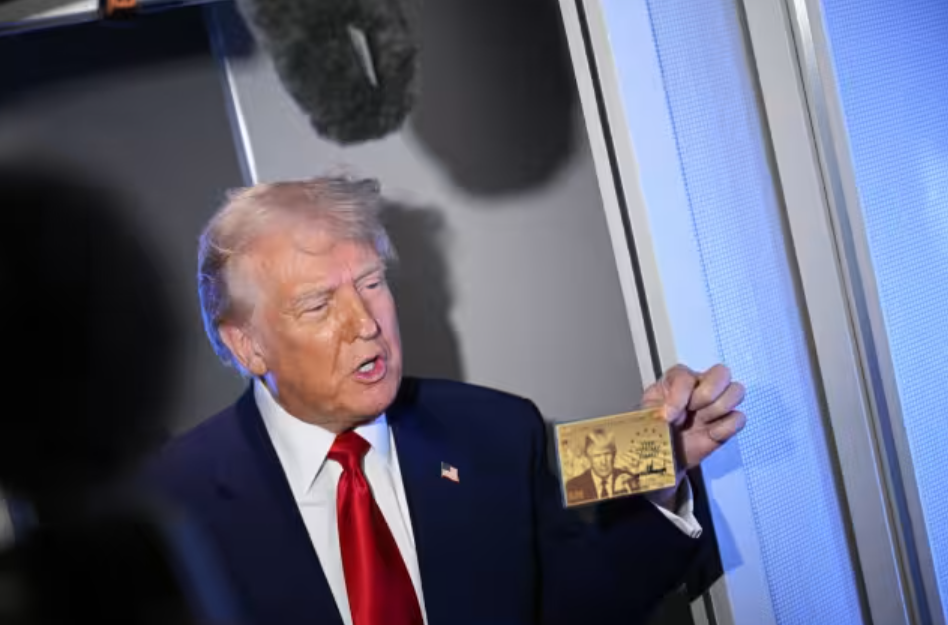 Trump displaying what he says is the Gold Card for $5M investors that he himself bought